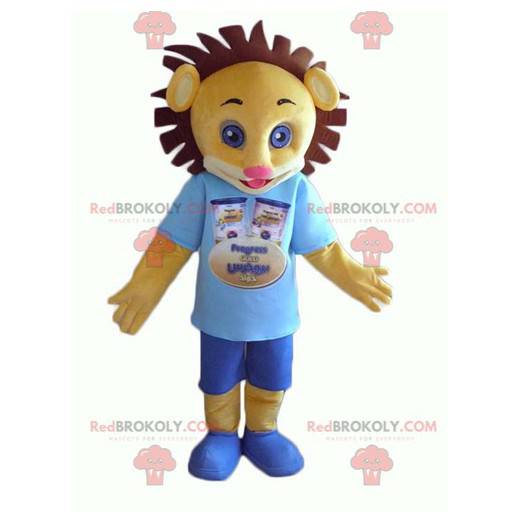 Mascot yellow and brown lion cub in blue outfit - Redbrokoly.com