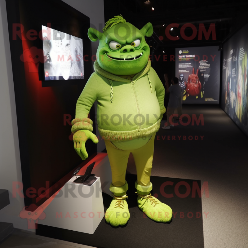 Lime Green Ogre mascot costume character dressed with a Skinny Jeans and Lapel pins Lime Green Ogre mascot costume character dressed with a Skinny Jeans and Lapel pins