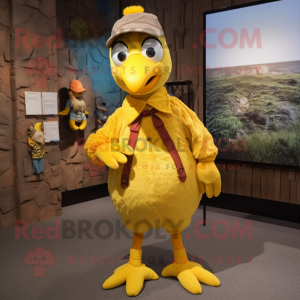 Yellow Quail mascot costume character dressed with a Corduroy Pants and Headbands