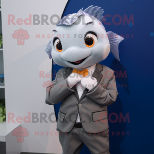 Gray Goldfish mascot costume character dressed with a Blazer and Smartwatches