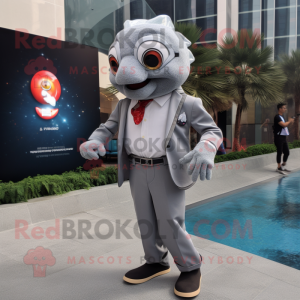 Gray Goldfish mascot costume character dressed with a Blazer and Smartwatches