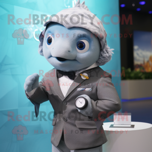 Gray Goldfish mascot costume character dressed with a Blazer and Smartwatches