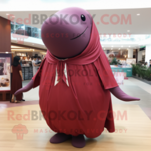 Maroon Whale mascot costume character dressed with a Blouse and Shawl pins