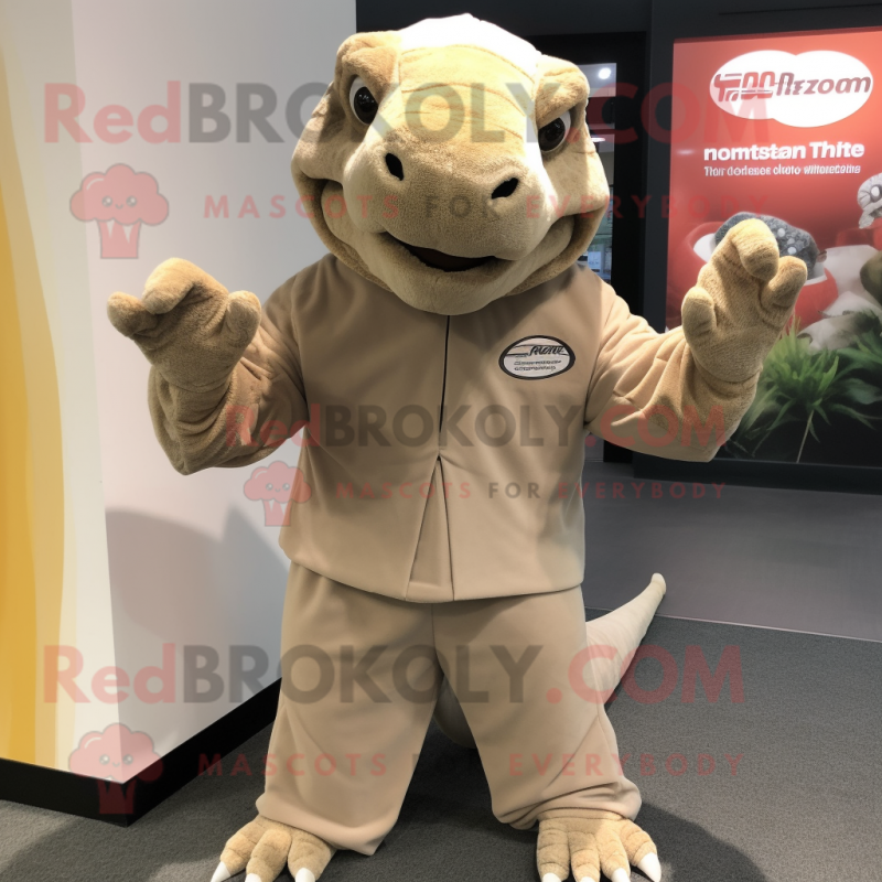 Beige Komodo Dragon mascot costume character dressed with a V-Neck Tee and Gloves Beige Komodo Dragon mascot costume character dressed with a V-Neck Tee and Gloves