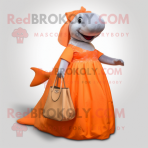 Orange Humpback Whale mascot costume character dressed with a Ball Gown and Tote bags