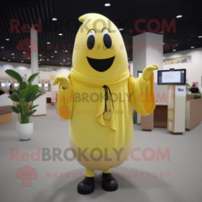 Gold Banana mascot costume character dressed with a Cardigan and Shawl pins