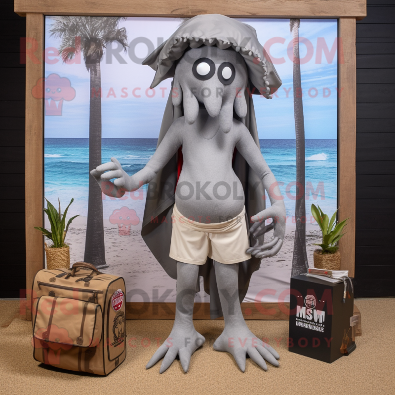 Gray Medusa mascot costume character dressed with a Board Shorts and Clutch bags Gray Medusa mascot costume character dressed with a Board Shorts and Clutch bags