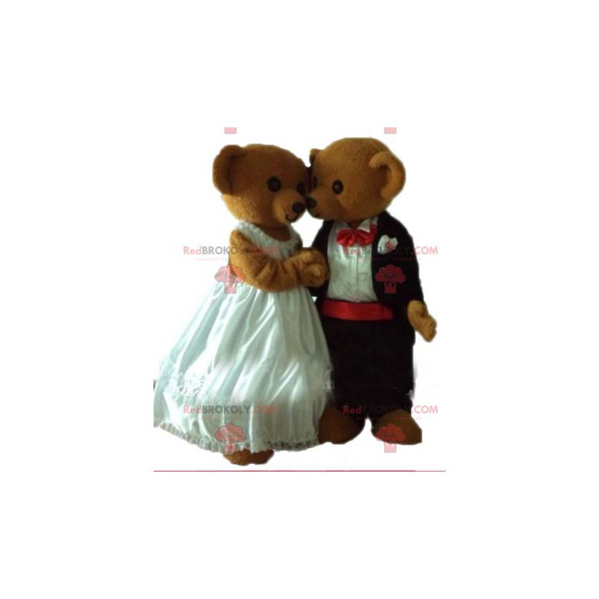2 mascotes ursinhos de pelúcia vestidos em trajes de casamento