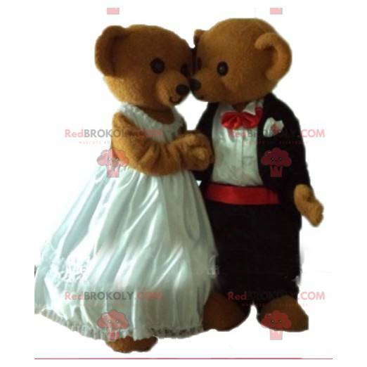 2 mascottes de nounours habillés en tenue de mariage -