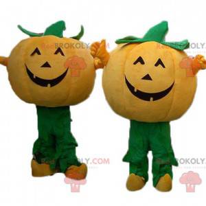 2 oranje en groene pompoenmascottes voor Halloween -