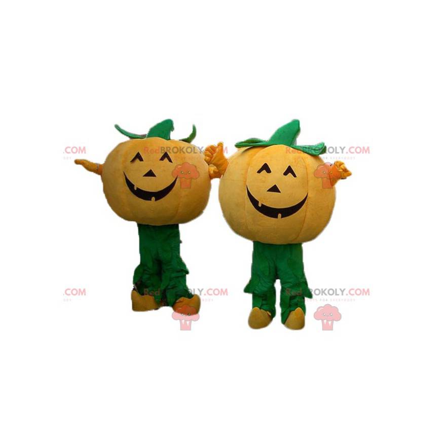 2 oransje og grønne gresskar maskoter til Halloween -