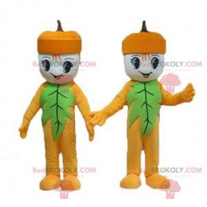 2 mascotes de bolotas de boneco de neve amarelas e verdes -