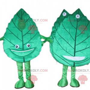 2 mascotes de folhas verdes gigantes e sorridentes -