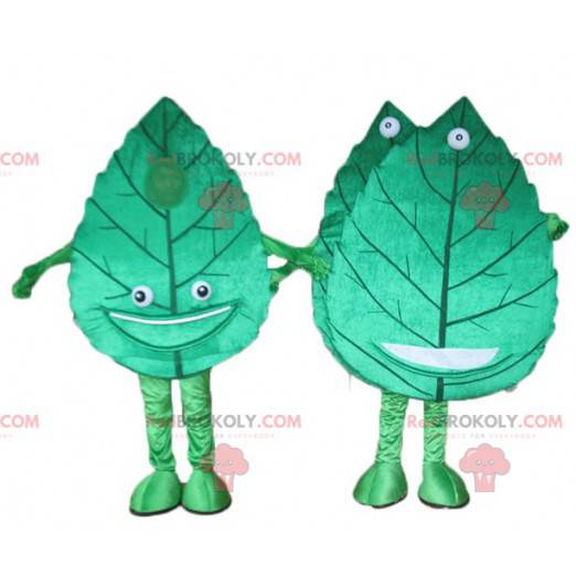 2 mascotes de folhas verdes gigantes e sorridentes -