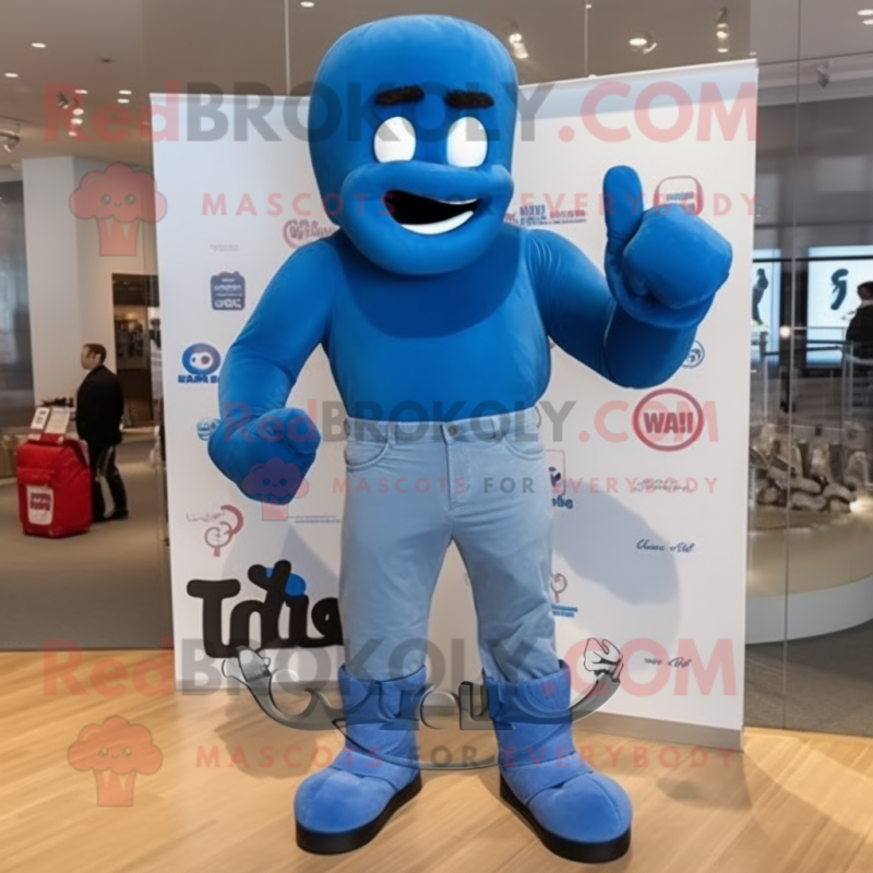 Blue Boxing Glove mascot costume character dressed with a Boyfriend Jeans and Backpacks