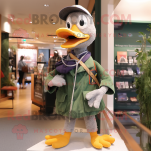 Olive Goose mascot costume character dressed with a Sweater and Keychains