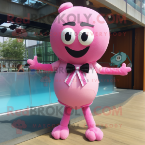 Pink Handball Ball mascot costume character dressed with a Swimwear and Bow ties