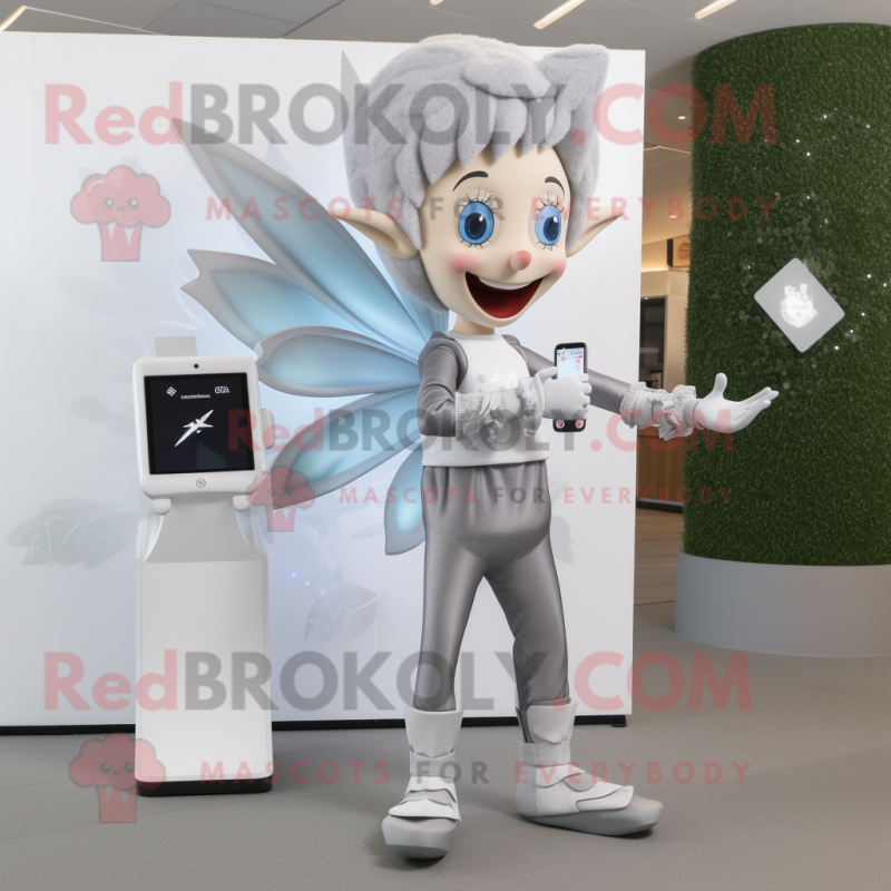 Silver Tooth Fairy mascot costume character dressed with a Dress Pants and Smartwatches