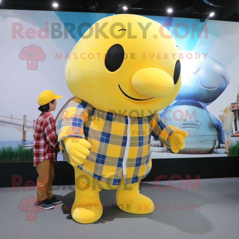 Yellow Whale mascot costume character dressed with a Flannel Shirt and Watches Yellow Whale mascot costume character dressed with a Flannel Shirt and Watches