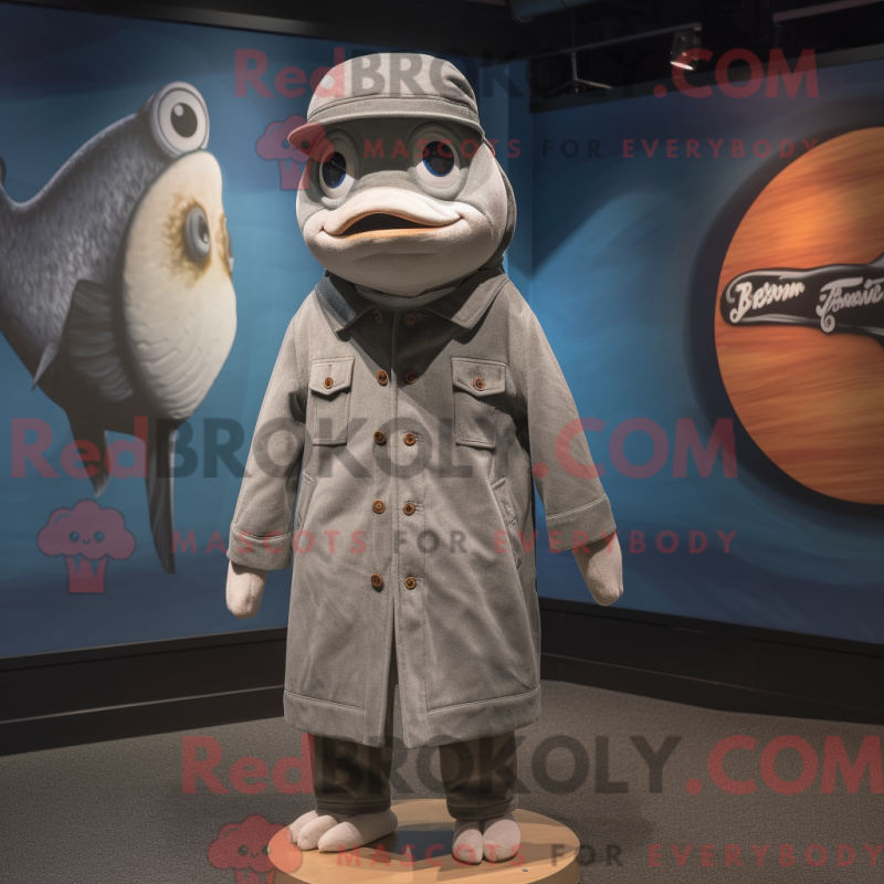 Mascot character of a Gray Salmon dressed with a Coat and Hat pins Mascot character of a Gray Salmon dressed with a Coat and Hat pins