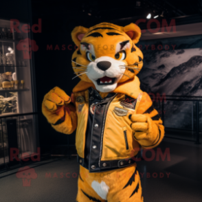 Yellow Tiger mascot costume character dressed with a Moto Jacket and Brooches