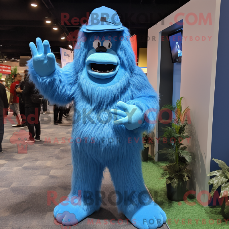 Mascot character of a Blue Sasquatch dressed with a A-Line Dress and Caps Mascot character of a Blue Sasquatch dressed with a A-Line Dress and Caps