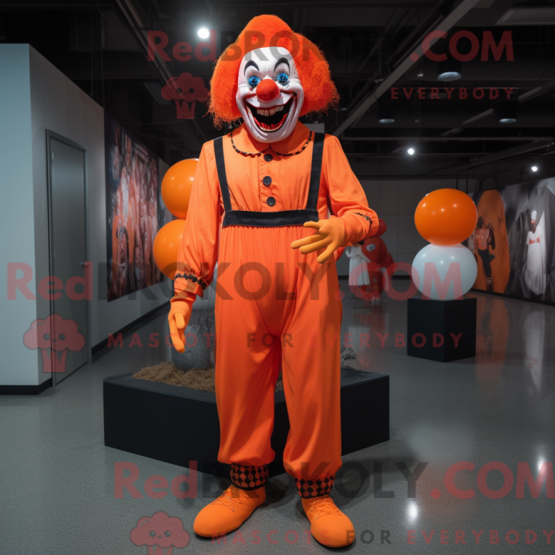 Mascot character of a Orange Evil Clown dressed with a Jeggings and Suspenders Mascot character of a Orange Evil Clown dressed with a Jeggings and Suspenders