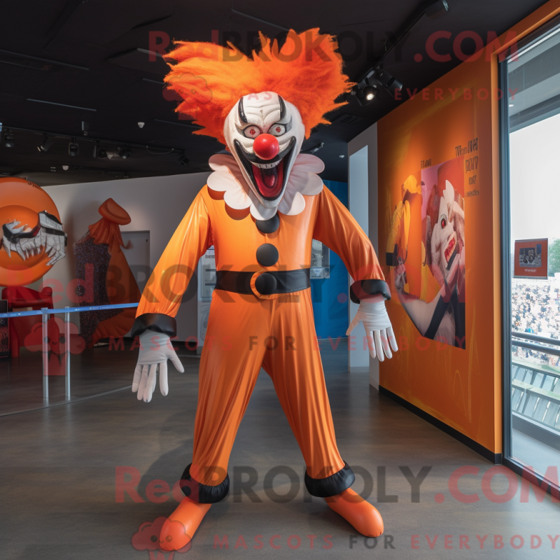 Mascot character of a Orange Evil Clown dressed with a Jeggings and Suspenders Mascot character of a Orange Evil Clown dressed with a Jeggings and Suspenders