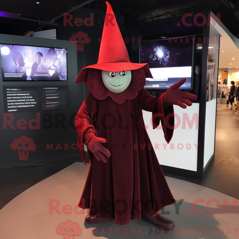 Mascot character of a Maroon Witch'S Hat dressed with a Trousers and Gloves Mascot character of a Maroon Witch'S Hat dressed with a Trousers and Gloves
