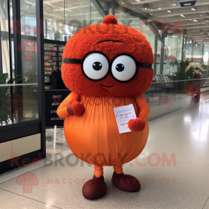 Orange Meatballs mascot costume character dressed with a Dress and Reading glasses
