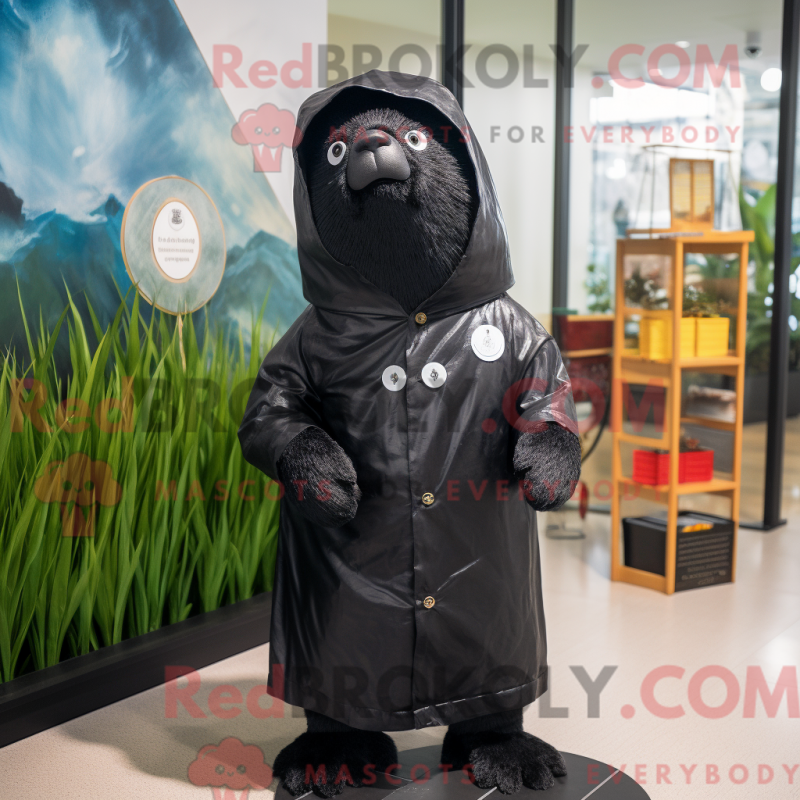Mascot character of a Black Seal dressed with a Raincoat and Messenger bags Mascot character of a Black Seal dressed with a Raincoat and Messenger bags