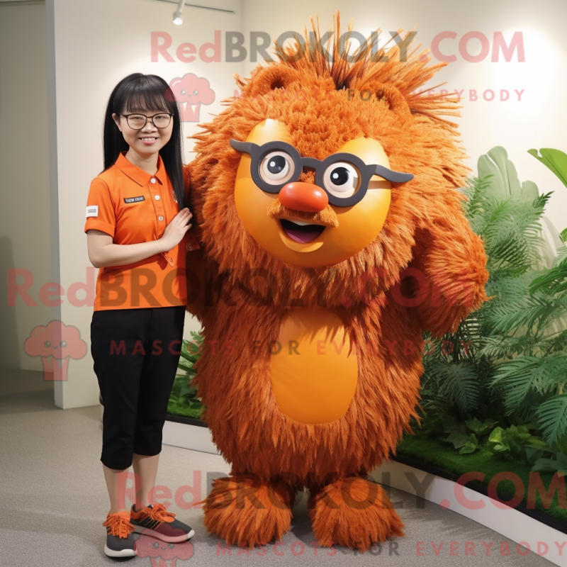 Mascot character of a Orange Porcupine dressed with a Blouse and Eyeglasses Mascot character of a Orange Porcupine dressed with a Blouse and Eyeglasses