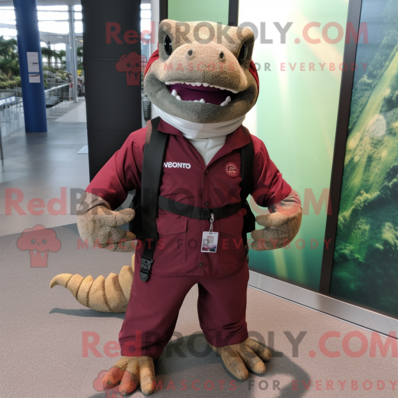 Mascot character of a Maroon Komodo Dragon dressed with a Cargo Pants and Keychains Mascot character of a Maroon Komodo Dragon dressed with a Cargo Pants and Keychains