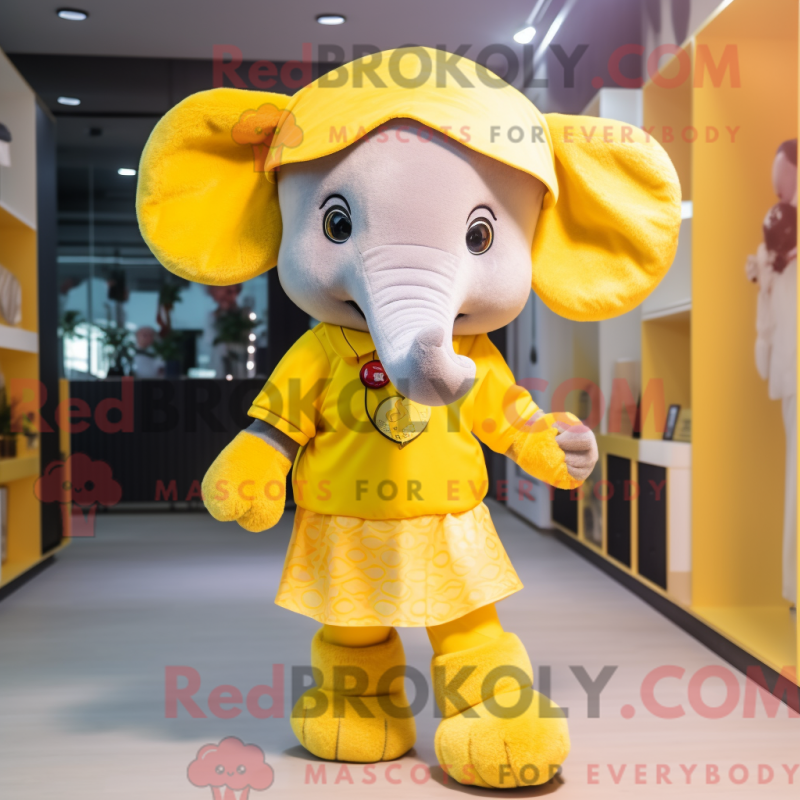 Mascot character of a Yellow Elephant dressed with a Mini Skirt and Headbands Mascot character of a Yellow Elephant dressed with a Mini Skirt and Headbands