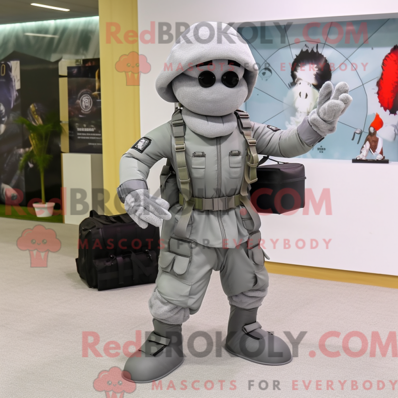 Mascot character of a Gray Para Commando dressed with a Circle Skirt and Briefcases Mascot character of a Gray Para Commando dressed with a Circle Skirt and Briefcases