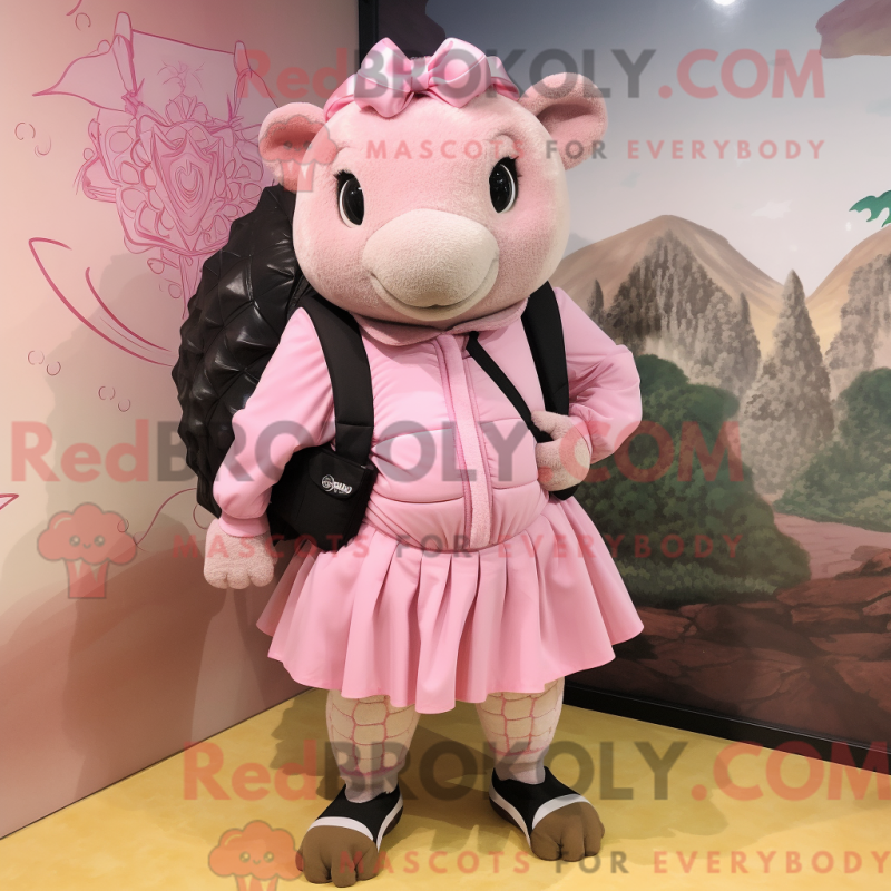 Mascot character of a Pink Glyptodon dressed with a Mini Dress and Backpacks Mascot character of a Pink Glyptodon dressed with a Mini Dress and Backpacks