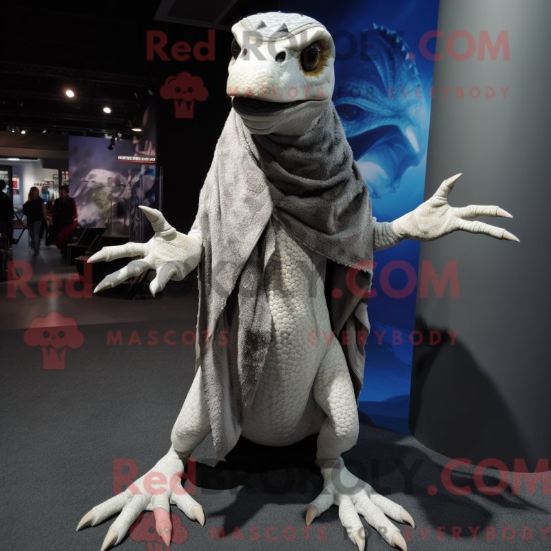 Mascot character of a Silver Velociraptor dressed with a Graphic Tee and Shawls Mascot character of a Silver Velociraptor dressed with a Graphic Tee and Shawls