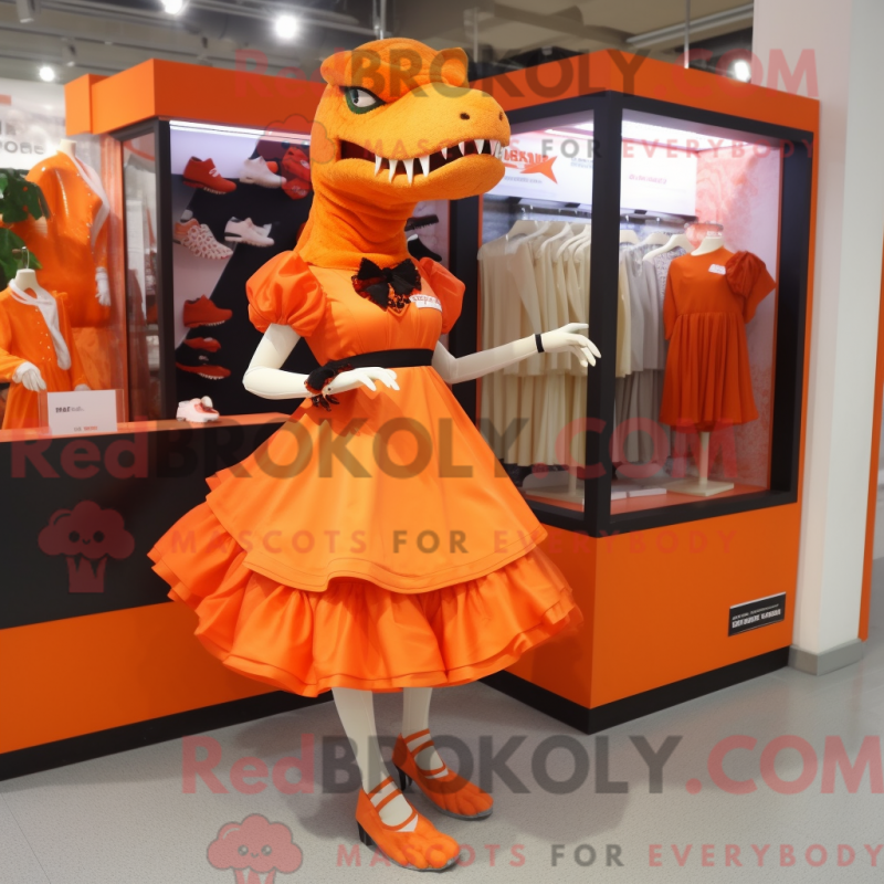Mascot character of a Orange Tyrannosaurus dressed with a Skirt and Shoe clips Mascot character of a Orange Tyrannosaurus dressed with a Skirt and Shoe clips