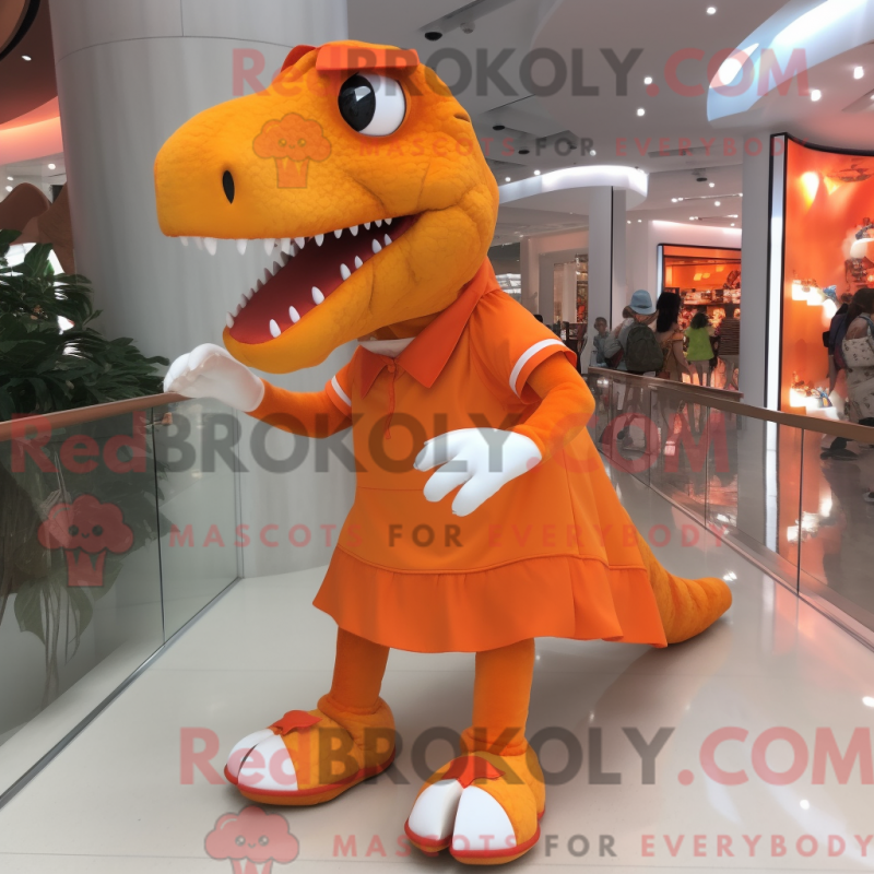 Mascot character of a Orange Tyrannosaurus dressed with a Skirt and Shoe clips Mascot character of a Orange Tyrannosaurus dressed with a Skirt and Shoe clips