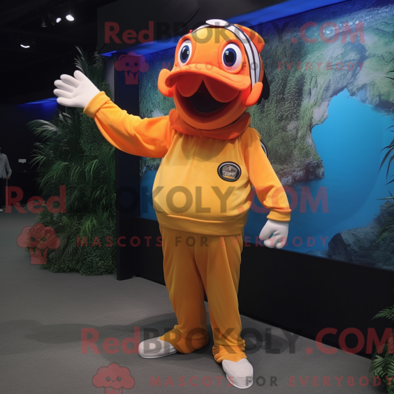 Mascot character of a Gold Clown Fish dressed with a Long Sleeve Tee and Caps Mascot character of a Gold Clown Fish dressed with a Long Sleeve Tee and Caps