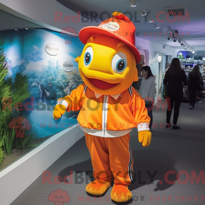 Mascot character of a Gold Clown Fish dressed with a Long Sleeve Tee and Caps Mascot character of a Gold Clown Fish dressed with a Long Sleeve Tee and Caps