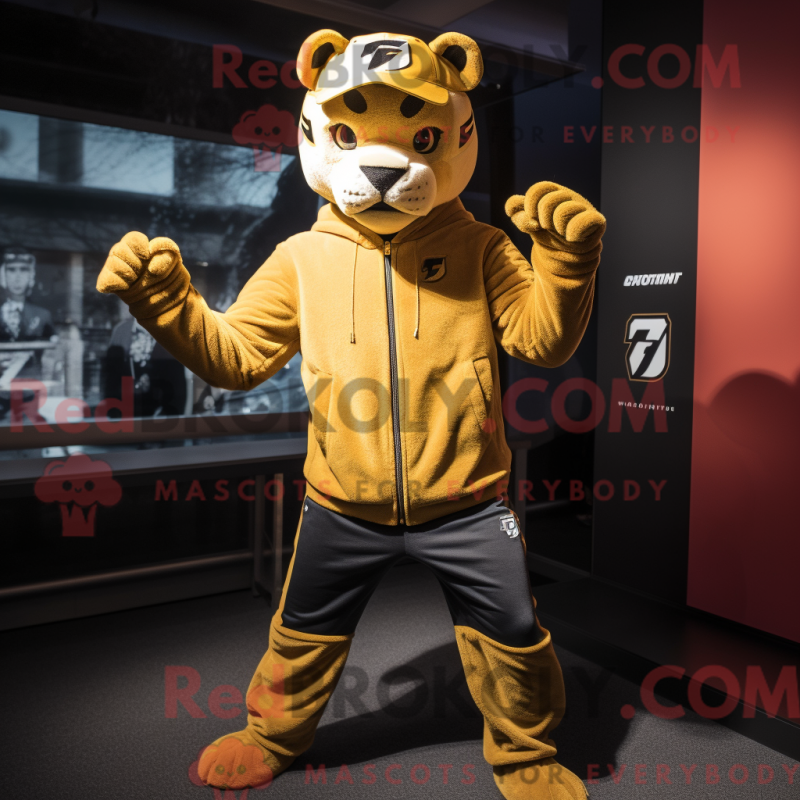 Mascot character of a Gold Puma dressed with a Long Sleeve Tee and Beanies Mascot character of a Gold Puma dressed with a Long Sleeve Tee and Beanies
