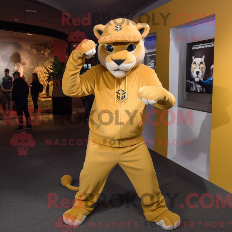 Mascot character of a Gold Puma dressed with a Long Sleeve Tee and Beanies Mascot character of a Gold Puma dressed with a Long Sleeve Tee and Beanies
