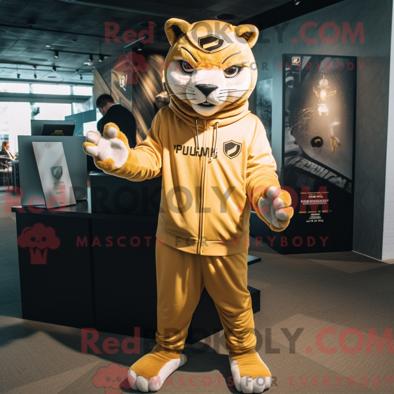 Mascot character of a Gold Puma dressed with a Long Sleeve Tee and Beanies Mascot character of a Gold Puma dressed with a Long Sleeve Tee and Beanies