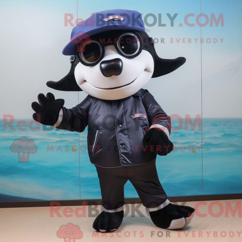 Mascot character of a Navy Killer Whale dressed with a Bermuda Shorts and Eyeglasses Mascot character of a Navy Killer Whale dressed with a Bermuda Shorts and Eyeglasses
