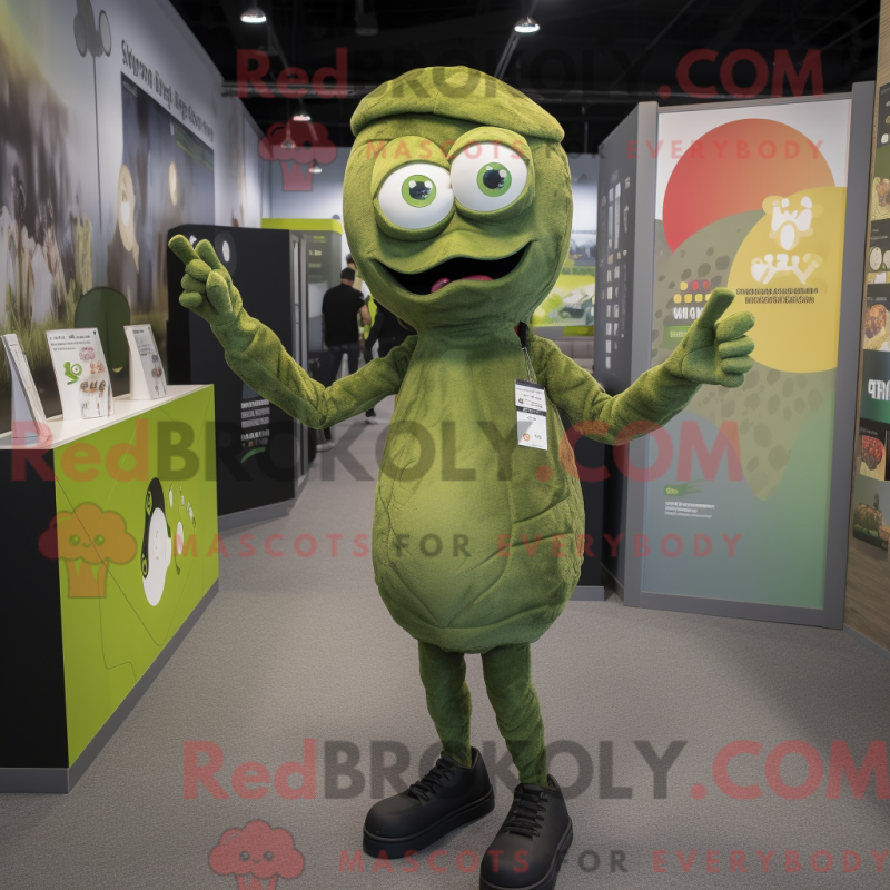 Mascot character of a Olive Zombie dressed with a Leggings and Rings Mascot character of a Olive Zombie dressed with a Leggings and Rings