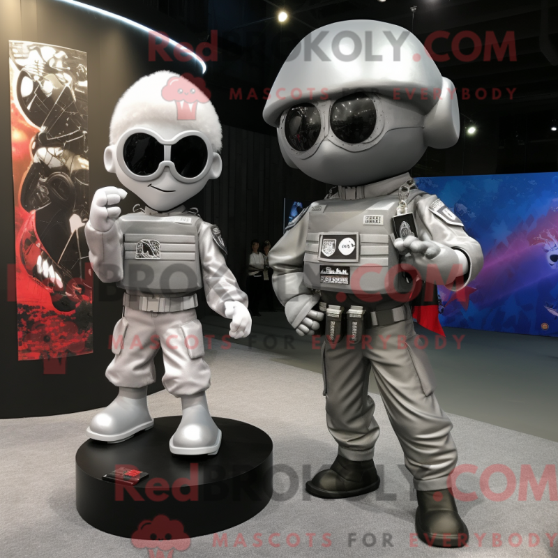 Mascot character of a Silver Para Commando dressed with a Evening Gown and Keychains Mascot character of a Silver Para Commando dressed with a Evening Gown and Keychains