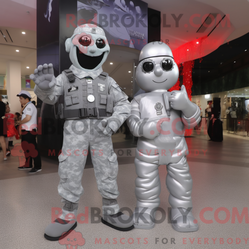 Mascot character of a Silver Para Commando dressed with a Evening Gown and Keychains Mascot character of a Silver Para Commando dressed with a Evening Gown and Keychains