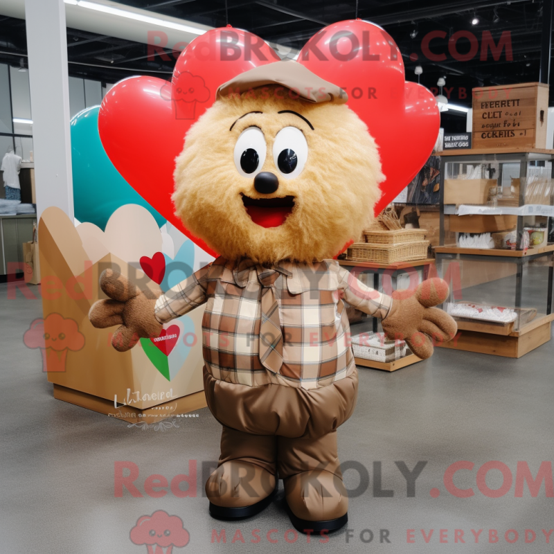 Mascot character of a Tan Heart Shaped Balloons dressed with a Flannel Shirt and Tote bags Mascot character of a Tan Heart Shaped Balloons dressed with a Flannel Shirt and Tote bags