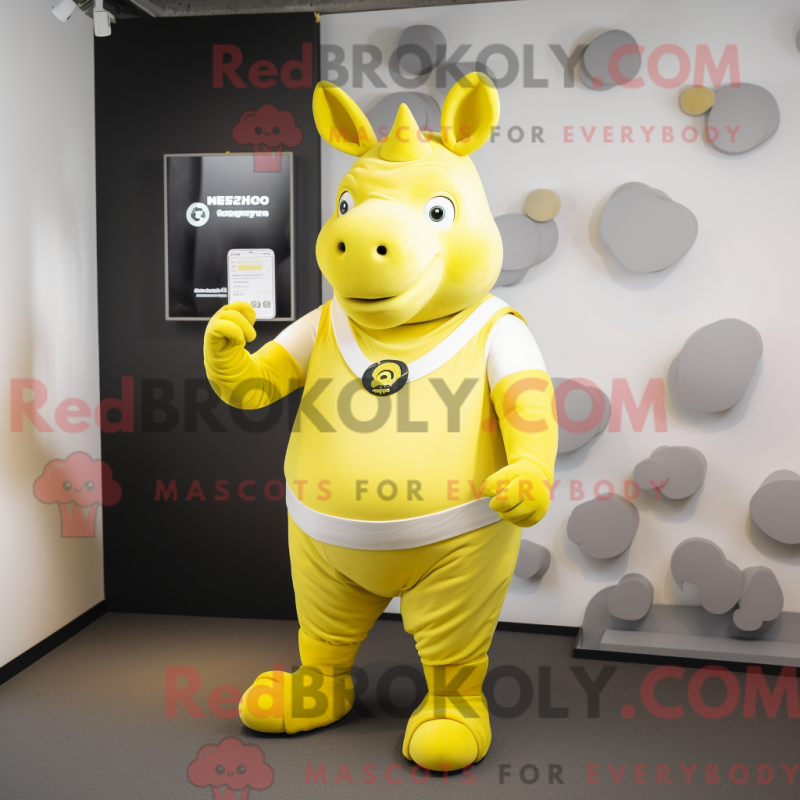 Mascot character of a Lemon Yellow Rhinoceros dressed with a Leggings and Smartwatches Mascot character of a Lemon Yellow Rhinoceros dressed with a Leggings and Smartwatches